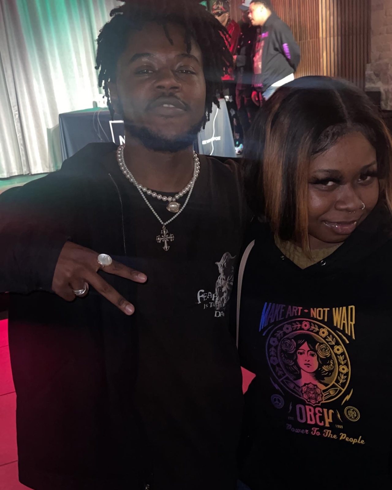 Kay Kay connecting with a guest at a community event