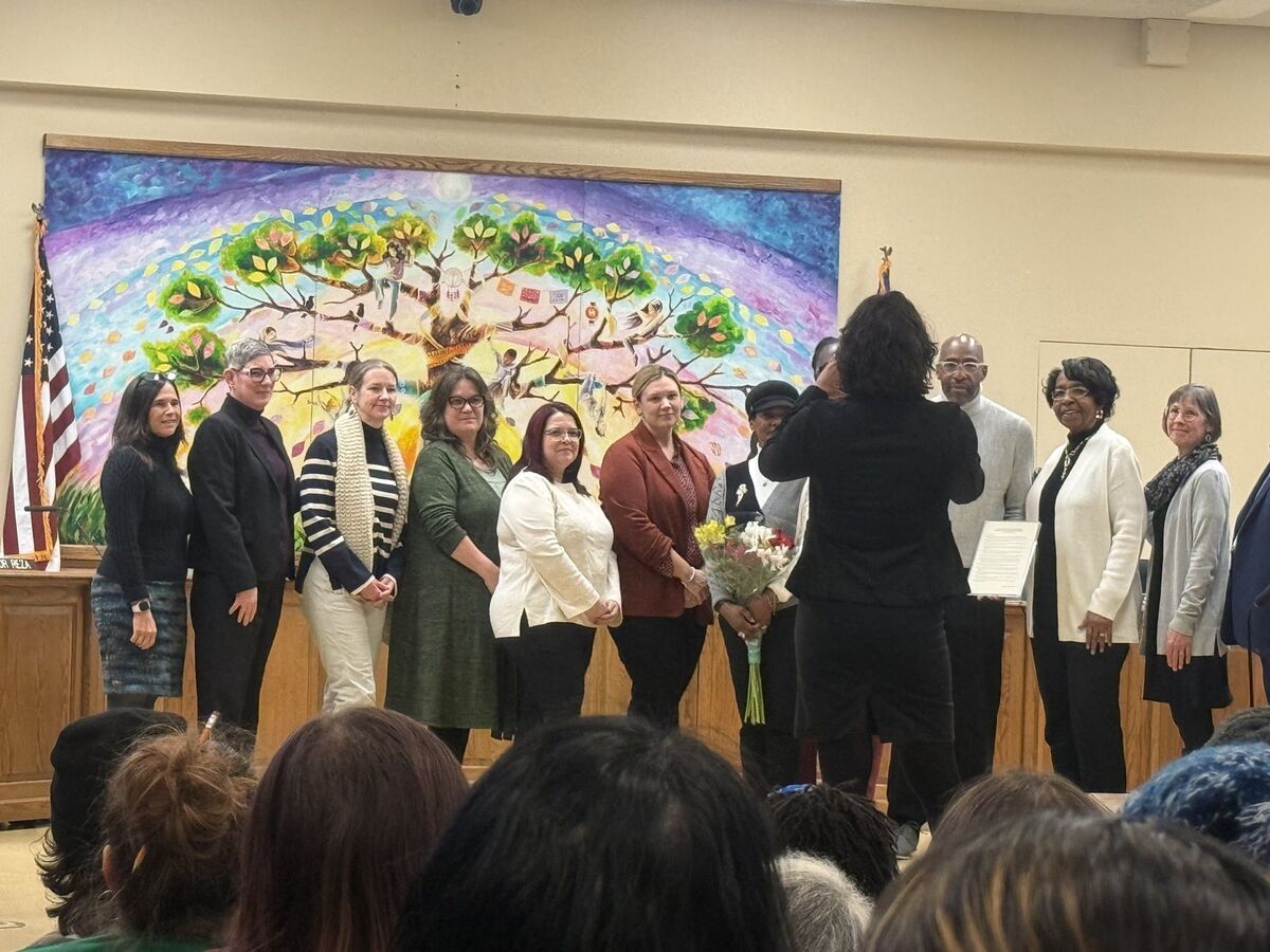 Community leaders participating in a recognition ceremony