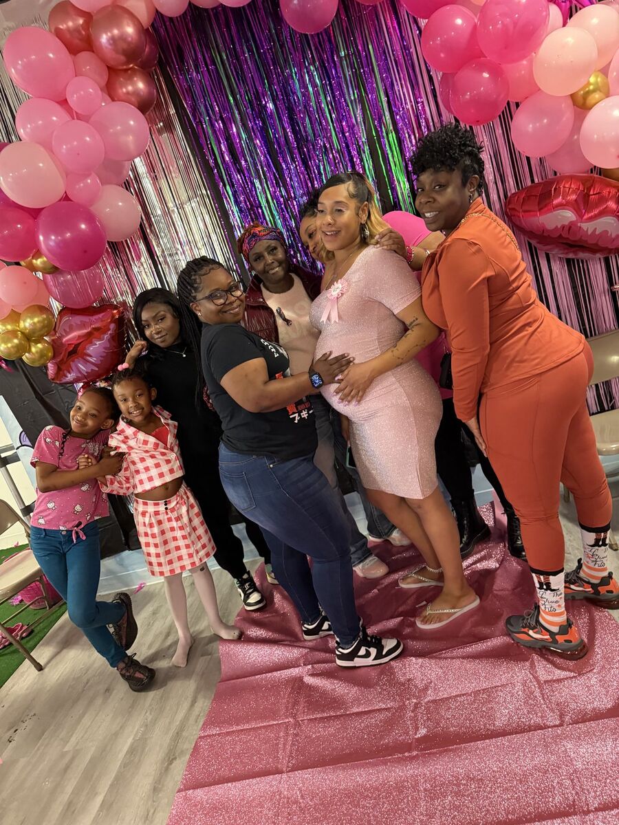 Friends celebrating together at a colorful community event