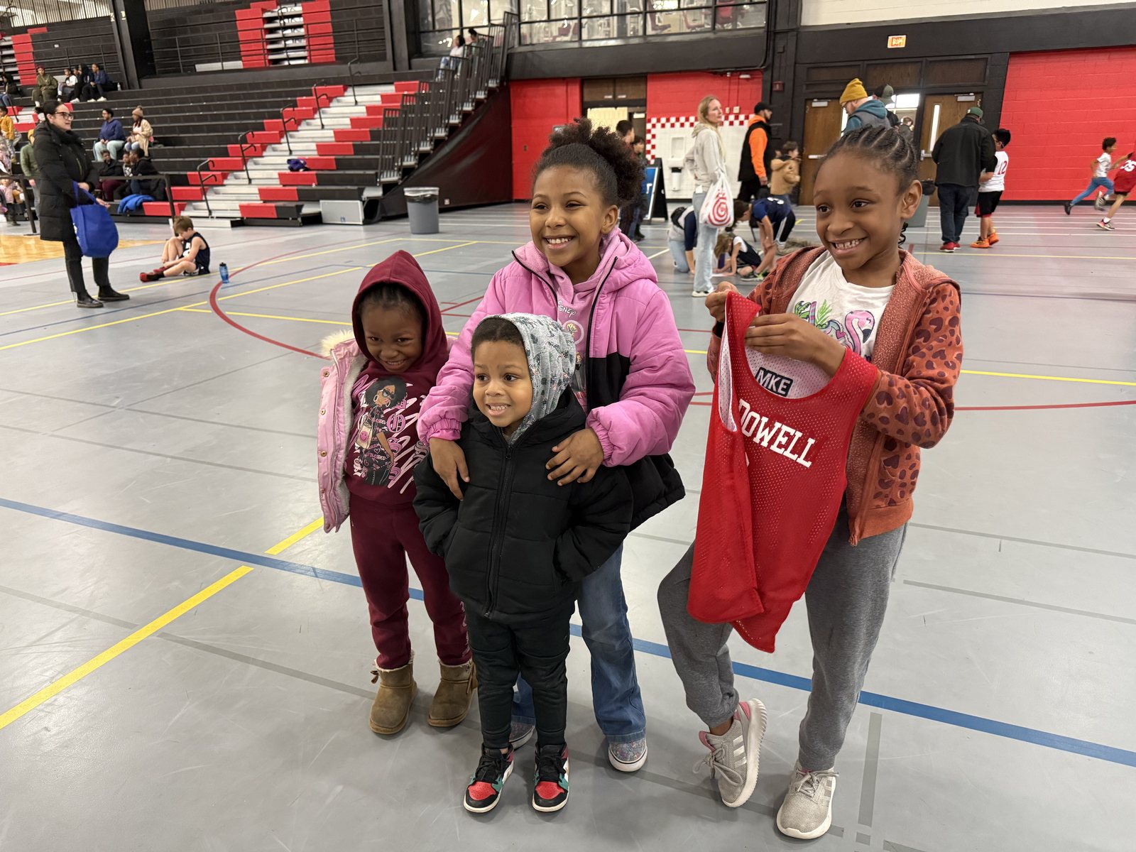 Kids smiling together at a past Suite 444 community event in Milwaukee